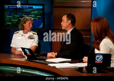 BUFFALO, N.Y. (Sept. 10, 2012) Rear Adm. Robin Graf, deputy commander of Navy Recruiting Command, talks to Patrick Taney and Ginger Geoffrey, news anchors for Buffalo's ABC news affiliate WKBW, about the Navy during the morning show. This event was one of many scheduled during the Navy’s commemoration of the bicentennial of the War of 1812 in Buffalo. (U.S. Navy photo by Mass Communication Specialist 1st Class Davis Anderson/Released) 120910-N-HZ247-027  Join the conversation www.facebook.com/USNavy www.twitter.com/USNavy navylive.dodlive.mil  - Official U.S. Navy Imagery - Rear Adm. Graf is i Stock Photo