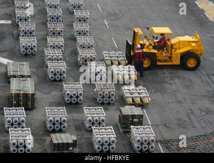 Sailors aboard USS Peleliu (LHA 5) man the rails during return to ...