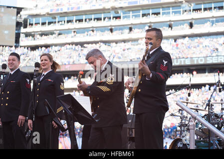 161106-N-HG258-125 East Rutherford, N.J. (November 6, 2016) Chief Petty Officer Ken Carr, left and Petty Officer 1st Class Athus Delima, right perform on guitar during a halftime show by the U.S. Navy Band at a National Football game between the New York Giants and Philadelphia Eagles. Members of the U.S. Navy Band Sea Chanters chorus and Cruisers contemporary music ensemble performed on the field at MetLife Staduim during a halftime show supporting the NFL's 'Salute to Service' game between the New York Giants and the Philadelphia Eagles. (U.S. Navy phot by SCPO Stephen Hassay/released) 16110 Stock Photo