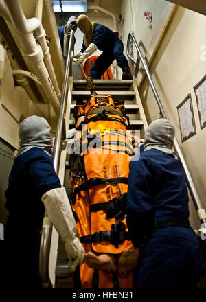 ARABIAN SEA (Oct. 11, 2012) Sailors move a simulated casualty during a general quarters drill aboard the amphibious transport dock ship USS New York (LPD 21). New York is part of the Iwo Jima Amphibious Ready Group with the embarked 24th Marine Expeditionary Unit (24th MEU) and is deployed in support of maritime security operations and theater security cooperation efforts in the U.S. 5th Fleet area of responsibility. The U.S. Navy is reliable, flexible, and ready to respond worldwide on, above, and below the sea. Join the conversation on social media using #warfighting. (U.S. Navy photo by Mas Stock Photo