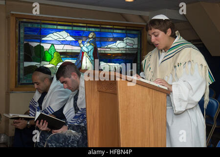 PACIFIC OCEAN (Sept. 25, 2012) Lt. j.g. Yonina Creditor, from Richmond, Va., a Jewish chaplain embarked aboard the aircraft carrier USS George Washington (CVN 73), leads Sailors in prayer during a Yom Kippur service in the ship’s chapel. George Washington and its embarked air wing, Carrier Air Wing (CVW) 5, provide a combat-ready force that protects and defends the collective maritime interest of the U.S. and its allies and partners in the Asia-Pacific region. (U.S. Navy photo by Mass Communication Specialist 3rd Class William Pittman/Released) 120925-N-SF704-119 Join the conversation http://w Stock Photo