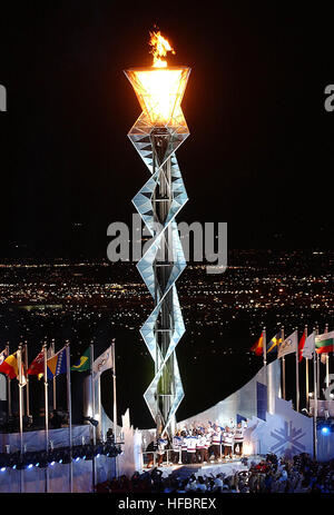 020208-N-3995K-001 Salt Lake City, UT (Feb. 8, 2002) -- Members of the 1980 Gold Medal U.S. Olympic hockey team stand below the Olympic flame after lighting it at Rice-Eccles Olympic Stadium during the opening ceremonies of the 2002 Winter Olympics in Salt Lake City.  The team had the honor of lighting the cauldron to invoke the official start of the competition.  U.S. Navy photo by Journalist 1st Class Preston Keres.  (RELEASED) 2002 Winter Olympics flame Stock Photo