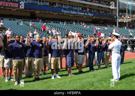 120830-N-CI293-097  CLEVELAND (Aug. 30, 2012) Cmdr. Mike Hudson, commanding officer of Navy Recruiting District Ohio, gives the oath of enlisted to delayed entry program recruits from cities in northeastern Ohio at Progressive Field prior to the Cleveland Indians baseball game against the Oakland A’s during Cleveland Navy Week. Cleveland Navy Week is one of 15 signature events planned across America in 2012. The weeklong event commemorates the Bicentennial of the War of 1812, hosting service members from the U.S. Navy, Marine Corps, Coast Guard and Royal Canadian Navy. (U.S. Navy photo by Seni Stock Photo