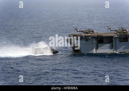 PACIFIC OCEAN (Aug. 1, 2012) Landing Craft Air Cushion (LCAC) 32, assigned to Assault Craft Unit (ACU) 5, prepares to enter the well deck of the amphibious assault ship USS Essex (LHD 2). Twenty-two nations, more than 40 ships and submarines, more than 200 aircraft and 25,000 personnel are participating in the biennial RIMPAC exercise from June 29 to Aug. 3, in and around the Hawaiian Islands. The world's largest international maritime exercise, RIMPAC provides a unique training opportunity that helps participants foster and sustain the cooperative relationships that are critical to ensuring t Stock Photo