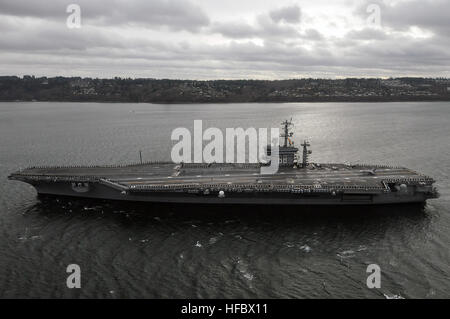 120309-N-DX364-002 EVERETT, Wash. (March 9, 2012) The Nimitz-class aircraft carrier USS Nimitz (CVN 68) arrives at its new homeport at Naval Station Everett after the completion of a docked planned incremental availability maintenance period at Bremerton, Wash. Nimitz is replacing USS Abraham Lincoln (CVN 72), which had been homeported at Naval Station Everett since January 1997. (U.S. Navy photo by Mass Communication Specialist 1st Class Joan E. Jennings/Released)  - Official U.S. Navy Imagery - USS Nimitz arrives at its new homeport at Naval Station Everett. (4) Stock Photo