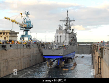 090924-N-3944N-005   PEARL HARBOR, Hawaii (Sept. 24, 2009) USS Port Royal (CG 73) undocks from Dry Dock 4 at Pearl Harbor Naval Shipyard. Port Royal was in dry dock for about seven months to repair damage sustained when the ship ran aground in February. (U.S. Navy photo by Liane Nakahara/Released)  - Official U.S. Navy Imagery - USS Port Royal prepares for re-float and undocking following repairs. Stock Photo