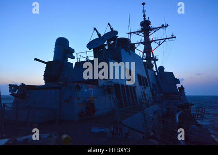 150311-N-UG232-079 WATERS TO THE EAST OF THE KOREAN PENINSULA (March 11, 2015) USS Lassen (DDG 82) transits underway at dusk during exercise Foal Eagle 2015. Foal Eagle is a series of annual training events that are defense-oriented and designed to increase readiness and maintain stability on the Korean Peninsula while strengthening the ROK-U.S. alliance and promoting regional peace and stability of the Indo-Asian-Pacific region. (U.S. Navy Photo by Mass Communication Specialist 1st Class Martin Wright/Released) Foal Eagle 2015 150311-N-UG232-079 Stock Photo