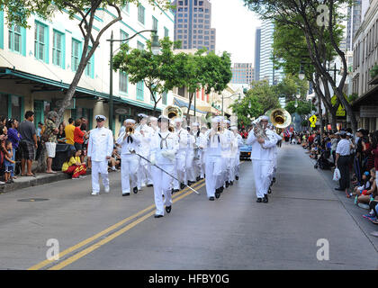 Members of the U.S. Navy Pacific Fleet Band march in downtown Chinatown during the 2014 Night in Chinatown Street Festival. The multi-block street festival in the heart of Chinatown featured live entertainment, foods and crafts. The Chinatown Merchants Association hosted the parade, which is held annually to celebrate the Chinese New Year. (U.S. Navy photo by Mass Communication Specialist 1st Class Nardel Gervacio/Released) 2014 Night in Chinatown Street Festival 140125-N-ZK021-011 Stock Photo
