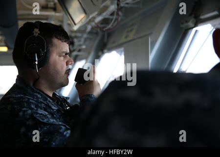 NEWPORT NEWS, Va. (Apr. 14, 2016) --  Gunner's Mate 1st Class Ernest Quinones, assigned to Pre-Commissioning Unit Gerald R. Ford (CVN 78), uses a sound-powered phone to talk to other Sailors on board during a General Quarters drill. This ship-wide general quarters drill focused on damage control and emergency responses and is a significant step in certifying the crew as they train to fight and take delivery of the ship. (U.S. Navy photo by Mass Communication Specialist Seaman Apprentice Gitte Schirrmacher/Released) Ford Sailors conduct General Quarters drill 160414-N-GY005-014 Stock Photo