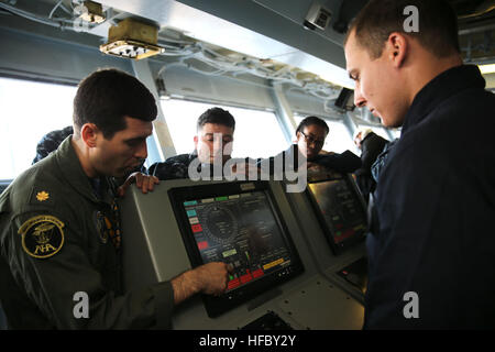 NEWPORT NEWS, Va. (Apr. 14, 2016) -- Lt. Cmdr. James Sullivan. assistant navigator aboard Pre-Commissioning Unit Gerald R. Ford (CVN 78), gives the first training on the steering gear control system during a General Quarters drill. This ship-wide general quarters drill focused on damage control and emergency responses and is a significant step in certifying the crew as they train to fight and take delivery of the ship. (U.S. Navy photo by Mass Communication Specialist Seaman Apprentice Gitte Schirrmacher/Released) Ford Sailors conduct General Quarters drill 160414-N-GY005-030 Stock Photo