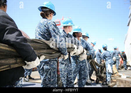 NEWPORT NEWS, Va. (Apr 14, 2016) -- Sailors assigned to Pre-Commissioning Unit Gerald R. Ford (CVN 78) move the emergency barricade on the flight deck during a General Quarters drill. This ship-wide General Quarters drill focused on damage control and emergency responses and is a significant step in certifying the crew as they train to fight and take delivery of the ship.  (U.S. Navy photo by Mass Communication Specialist Seaman Apprentice Connor Loessin/Released) General Quarters 160414-N-YW238-005 Stock Photo