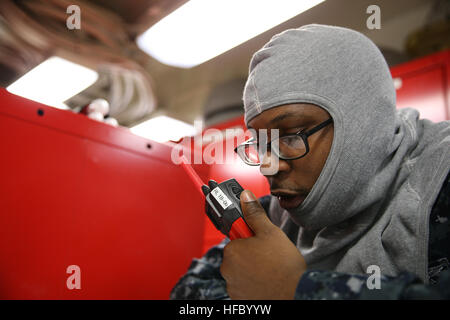 NEWPORT NEWS, Va. (Apr 14, 2016) -- Ensign William Batten assigned to Pre-Commissioning Unit Gerald R. Ford (CVN 78) calls to on-scene investigators during a General Quarters drill. This ship-wide General Quarters drill focused on damage control and emergency responses and is a significant step in certifying the crew as they train to fight and take delivery of the ship. (U.S. Navy photo by Mass Communication Specialist Seaman Apprentice Connor Loessin/Released) General Quarters 160414-N-YW238-063 Stock Photo