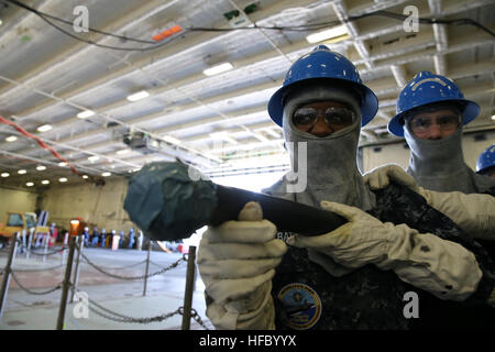 NEWPORT NEWS, Va. (Apr 14, 2016) -- Aviation Boatswain's Mate (Handling) Airman Recruit Mariann Battee and Airman Shane Sandahl assigned to Pre-Commissioning Unit Gerald R. Ford (CVN 78) practice firefighting techniques in the ship's hangar bay during a General Quarters drill. This ship-wide General Quarters drill focused on damage control and emergency responses and is a significant step in certifying the crew as they train to fight and take delivery of the ship. (U.S. Navy photo by Mass Communication Specialist Seaman Apprentice Connor Loessin/Released) General Quarters 160414-N-YW238-100 Stock Photo