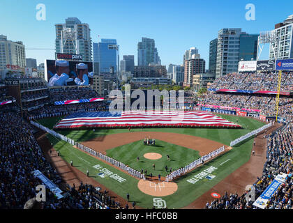 160712-N-NV908-496 SAN DIEGO (July 12, 2016) Sailors man the rails while Marines hold up the American flag during the pre-game ceremony of the 2016 Major League Baseball All-Star Game at Petco Park. Sailors from the aircraft carrier USS Theodore Roosevelt (CVN 71) and Marines from the 3rd Marine Aircraft Wing joined together to participate in a salute to the United States Armed Forces. (U.S. Navy photo by Mass Communication Specialist 3rd Class Chad M. Trudeau) 2016 Major League Baseball All-Star Game Stock Photo
