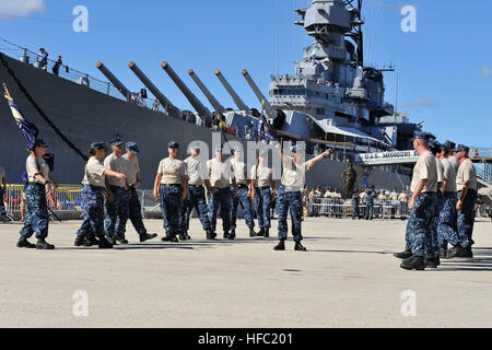 Chief selectees from Naval Information and Operations Command participate in the Inaugural Chief Petty Officer (CPO) Pride Day Hawaii Marching and Cadence Competition, at the Battleship Missouri Memorial located on Ford Island, Joint Base Pearl Harbor-Hickam, Sept. 4. Hawaii-based CPOs designed this event to instill and promote CPO pride, mess cohesion and to encourage cross-island CPO communication through competition.  Chiefs and selectees gathered at the historical site to strengthen camaraderie and promote CPO heritage.  (Department of Defense Photo by U.S. Navy Petty Officer 1st Class Cyn Stock Photo