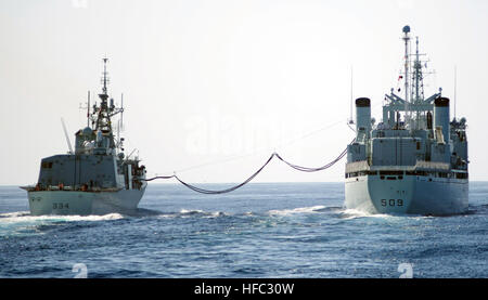 131010-N-ZF681-125  PACIFIC OCEAN (Oct. 10, 2013)-- The Canadian Halifax-class frigate HMCS Regina (FFH 334) conducts an underway replenishment with the Canadian Protecteur-class auxiliary oiler replenishment ship HMCS Protecteur (AOR 509) during a Task Group Exercise (TGEX). U.S. and Canadian Sailors participated in a TGEX off the coast of Southern California Oct. 7-11. The exercise trained independent deployers in air defense, anti-submarine and anti-surface warfare and maritime interdiction operations, while also building a strong working relationship between the maritime and aviation force Stock Photo