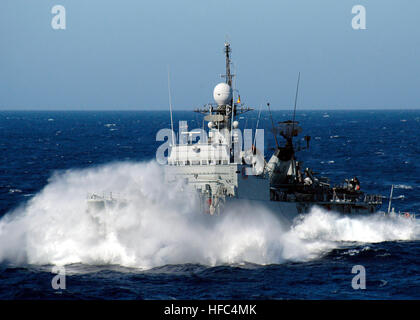 060604-N-8547M-003 Mediterranean Sea (June 4, 2006) - Spanish corvette SPS Infanta Elena (P-76) crashes through the waves while coming along side the amphibious assault ship USS Saipan (LHA 2) during a Photographic Exercise (PHOTOEX). Saipan is participating in a multi-national combined exercise with North African and European forces during exercise Phoenix Express. The exercise provides U.S. and allied forces an opportunity to participate in diverse maritime training scenarios helping to increase maritime domain awareness and strengthen emerging and enduring partnerships. U.S. Navy photo by P Stock Photo