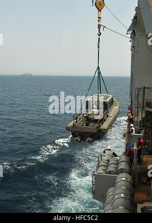 U.S. sailors aboard the dock landing ship USS Gunston Hall (LSD 44) lower a rigid hull inflatable boat into the water as the ship prepares to conduct a passenger exchange with the amphibious transport dock USS New York (LPD 21) in the Gulf of Aden Sept. 15, 2012. Gunston Hall and the embarked U.S. Marines assigned to the 24th Marine Expeditionary Unit are supporting maritime security operations and theater security cooperation efforts in the U.S. 5th Fleet's area of responsibility while deployed with the Iwo Jima Amphibious Ready Group. (U.S. Navy photo by Mass Communication Specialist 3rd Cla Stock Photo