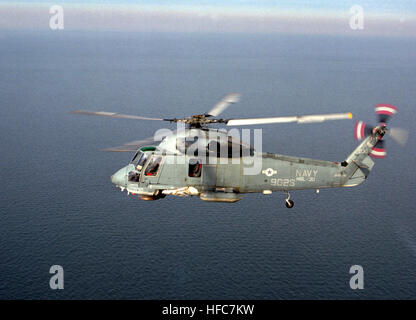 An air-to-air left side view of an SH-2F Sea Sprite helicopter of Light Helicopter Antisubmarine Squadron 30 (HSL-30). Kaman SH-2F Seasprite of HSL-30 in flight in January 1986 Stock Photo