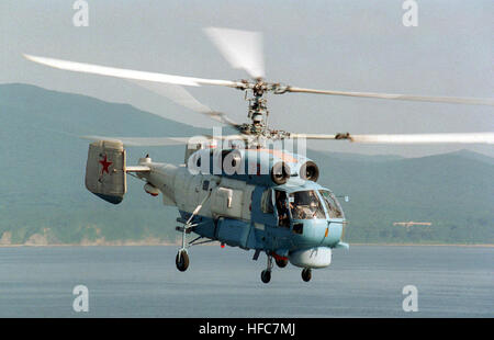 A Russian KA-27SP (Helix D) helicopter flies past the flight deck of USS BELLEAU WOOD (LHA 3) (not shown) to prepare for landing on the amphib ious assault ship during Exercise COOPERATION FROM THE SEA '96, off the coast of Vladivostok, Russia.  The landing marks the first time a Russian helicopter has touched down on a US Navy ship as part of this annual exercise. Kamov Ka-27PS Stock Photo