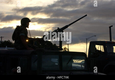 020110-N-3235P-507 Guantanamo Bay, Cuba, Jan. 10, 2002 -- A Marine positions himself behind 50 cal. gun mounted on a Humvee all terrain vehicle during a convoy detainee rehearsal run from the airport to Camp X-Ray.  Camp X-Ray will be one of the holding facilities for Taliban and Al Qaida detainees.  U.S. Navy photo by PhotographerÕs Mate 1st Class Michael W. Pendergrass  (RELEASED) 020110-N-3235P-507 Marine Patrol Camp X-Ray Stock Photo