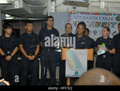 INDIAN OCEAN (June 30, 2016) The Diversity Committee, aboard the submarine tender USS Frank Cable (AS 40), gather to talk about LGBT, June 30.  Frank Cable is on a scheduled deployment in the US. 7th Fleet area of operations to conduct maintenance and support deployed U.S naval force submarines and surface vessels in the Indo-Asia-Pacific region.   (U.S. Navy Photo by Mass Communication Specialist Seaman Josh Coté/Released) LGBT Pride Month Aboard USS Frank Cable 160630-N-UJ449-032 Stock Photo