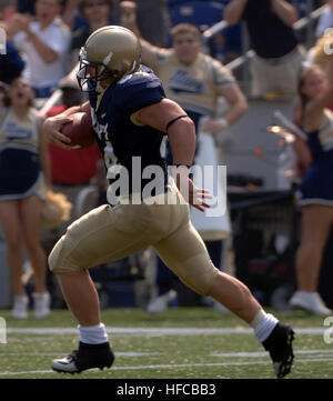 U.S. Navy Midshipman Brye French, a linebacker with the U.S. Naval Academy  football team, watches the U…