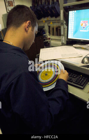 080618-N-1038M-034 PACIFIC OCEAN (June 18, 2008) Aerographer's Mate 2nd Class Kristopher Rodriguez, a native of Baltimore, Md., uses a dew point calculator in the meteorology and oceanography center of the aircraft carrier USS Kitty Hawk (CV 63). Aerographers log weather conditions every half-hour during flight operations and every hour otherwise, then report the conditions to the air traffic controllers. Kitty Hawk is returning to the United States for decommissioning after 47 years of service. The ship will be replaced by the nuclear-powered aircraft carrier USS George Washington (CVN 73) la Stock Photo