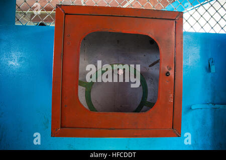 Hand painted empty fire reel hose cabinet Stock Photo