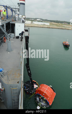 140412-N-XB010-012 ROTA, Spain (April 12, 2014) Crew members of the Military Sealift Command container ship MV Cape Ray (T-AKR 9679) deploy a marine evacuation system. The marine evacuation system is a life-saving device found on many modern passenger ships consisting of an inflatable slide or escape chute where the crew can rapidly evacuate into awaiting life raft. (U.S. Navy photo by Mass Communication Specialist Seaman Desmond Parks/Released) MV Cape Ray operations 140412-N-XB010-012 Stock Photo