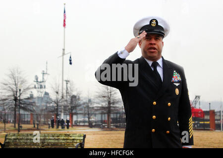 Command Master Chief Bryan Exum, command master chief of Naval Sea Systems Command, reports to Vice Adm. Willy Hilarides, commander of Naval Sea Systems Command, that his flag has been broken atop the mast on the Washington Navy Yard during a christening ceremony for the Humphreys Building, Building 197, at the Washington Navy Yard. At the conclusion of the ceremony, the doors were officially opened, marking the first time NAVSEA employees would return to work since being displaced following the tragic events of Sept. 16, 2013. The new building is named in honor of 19th century American frigat Stock Photo