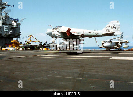 An US Navy VA-75 (Attack Squadron Seven Five, the 'Sunday Punchers') A-6E Intruder prepares to catch the hook as it lands onboard the USS ENTERPRISE (CVN-65).  The USS ENTERPRISE  is attached to the Sixth Fleet and conducting flight operations in the Adriatic Sea in support of Operation Joint Endeavor.  Operation Joint Endeavor is a peacekeeping effort by a multinational Implementation Force (IFOR), comprised of NATO and non-NATO military forces, deployed to Bosnia in support of the Dayton Peace Accords. A-6E Intruder lands on USS Enterprise Stock Photo