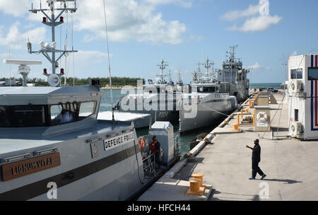 KEY WEST, Fla. (Oct. 5, 2016) Nine ships from the Royal Bahamas Defence Force, research vessel Walton Smith and a contract vessel take shelter at Naval Air Station Key West’s Mole Pier Oct. 5 as Hurricane Matthew approaches Florida. NAS Key West is not currently projected to be in Matthew’s path and as such, stands by to support other services and relief efforts. NAS Key West is a state-of-the-art facility for air-to-air combat fighter aircraft of all military services and provides world-class pierside support to U.S. and foreign naval vessels. (U.S. Navy Photo by Petty Officer 2nd Class Cody  Stock Photo