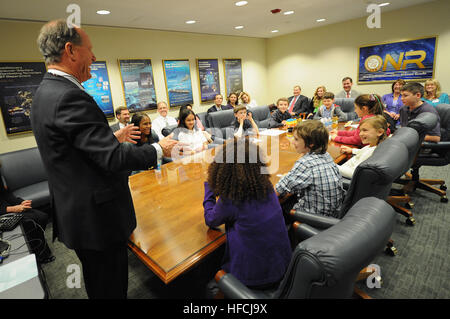 Dr. Robert Ballard, ocean explorer and director of the Center for Ocean Exploration at the University of Rhode Island's graduate school of oceanography, visits with children of Office of Naval Research employees at ONR. Ballard is known for his exploration of the wreck of the RMS Titanic. He began his relationship with ONR as a naval reserve officer assigned as scientific liaison to ONR's branch office in Boston and assignment to the Woods Hole Oceanographic Institution. (U.S. Navy photo by John F. Williams) Office of Naval Research 120418-N-PO203-056 Stock Photo