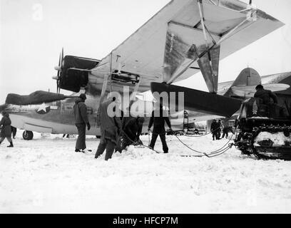 PBY being secured during storm on Amchitka Island 1943 Stock Photo