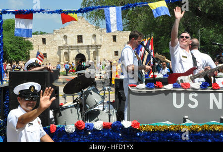 100423-N-UR169-135 SAN ANTONIO (April 23, 2010) Members of the Electric Brigade, the U.S. Naval Academy Band belt out contemporary tunes as they ride the Navy battleship float with representatives of the Navy Operational Support Center San Antonio, USS San Antonio (LPD 17), Navy Recruiting District San Antonio, Naval Technical Training Center, and Rear Adm. Albert Garcia III, deputy commander, Naval Facilities Engineering Command, deputy chief of Civil Engineers, in the Battle of Flowers Parade as part of Navy Week. The San Antonio Navy Week began April 14 and runs through April 25. (U.S. Navy Stock Photo