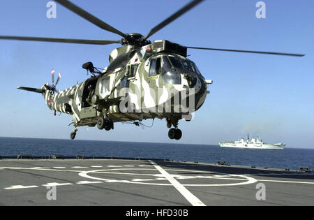 020223-N-6077T-031 At sea aboard USNS Pecos (TAO 197) Feb. 23, 2002 -- A British Royal Navy MK-6 ÒSea KingÓ helicopter, assigned to the British Royal Navy aircraft carrier HMS Illustrious, prepares to land aboard the U.S. Military Sealift Command (MSC) ship USNS Pecos during a joint training evolution with members of the assigned to Commando Unit 40, Company D Royal Marines, and U.S. Navy SEAL (Sea Air Land) team members.  HMS Illustrious is currently deployed as part of a multi-national, coalition force, conducting missions in support of Operation Enduring Freedom.  U.S. Navy photo by Photogr Stock Photo