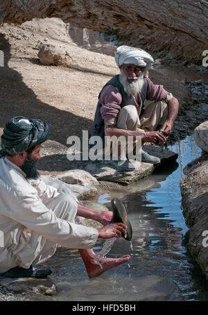 GHAZNI PROVINCE, Afghanistan (March 17, 2010) — A man washes his feet in a village stream in Ghazni Province. (U.S. Navy photo by Petty Officer 1st Class Mark O’Donald/Released) Sole Comfort 274008 Stock Photo