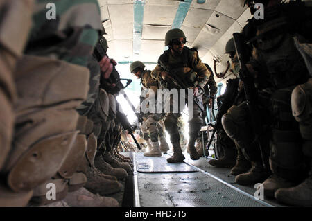 100402-N-6031Q-003 KABUL, Afghanistan - Afghan Commandos from the Sixth Commando Kandak practices infiltration techniques using the  on April 1, 2010 at Camp Morehead in the outer regions of Kabul. The training was in preparation for future air assault missions needed in order to disrupt insurgent activity and bring stability to the population and the region. (US Navy photo by Mass Communication Specialist 2nd Class David Quillen/ RELEASED). Afghan Commandos from the Sixth Commando Kandak practices infiltration techniques during an assault exercise. (4489762534) Stock Photo