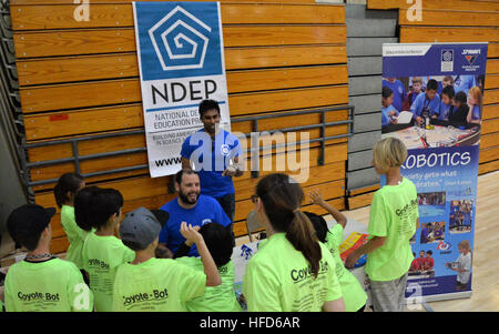 SPAWAR personnel engage students in robotics competitions at Eastlake High School, combining STEM education, engineering skills, and hands-on robotics design and programming. Stock Photo