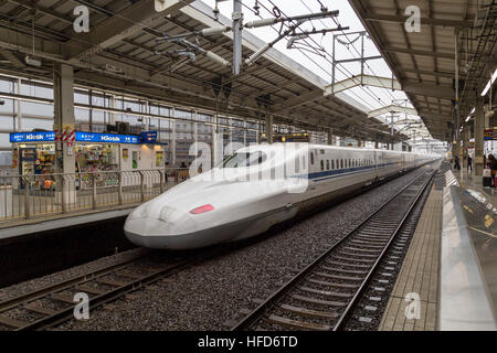 Kyoto, Japan - December 16, 2014: A Shinkansen high speed train arriving at the train station Stock Photo