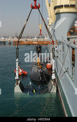 030611-N-5972N-001 Manama, Bahrain (Jun. 11, 2003) -- The Royal Danish Navy submarine Her Danish MajestyÕs Ship HDMS Saelen sits securely in a sling during lift operations with the German contract vessel Grietje.  The submarine will be transported from Bahrain to Denmark inside the Grietje in the Danish Navy's first cost-saving trial.  U.S. Navy photo by Lt. Rick Naystatt.  (RELEASED) The Royal Danish Navy submarine Her Danish Majesty's Ship HDMS Saelen is lifted aboard the German contract vessel Grietje -e Stock Photo