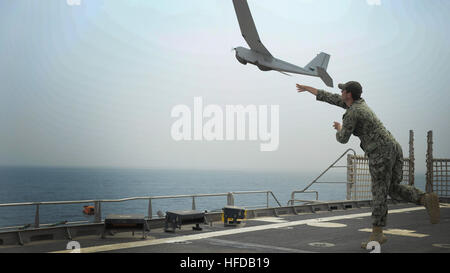 150129-N-RB579-071 ATLANTIC OCEAN (Jan. 29, 2015) Information Technology Specialist 2nd Class Joshua Lesperance launches a Puma unmanned aerial vehicle during maritime law enforcement operations aboard the USNS Spearhead (JHSV 1), Jan. 29, 2015. Spearhead is on a scheduled deployment to the U.S. 6th Fleet area of operations in support of the international collaborative capacity-building program Africa Partnership Station. (U.S. Navy photo by Mass Communication Specialist 1st Class Joshua Davies/Released) Africa Partnership Station 150129-N-RB579-071 Stock Photo