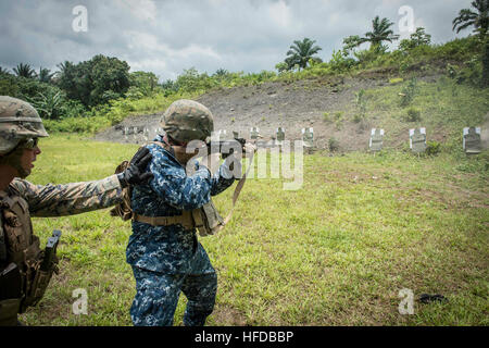 150314-N-JP249-100 ISSONGO, Cameroon (March 14, 2015) U.S. 6th Fleet Vice Commander Rear Adm. Tom Reck fires an AK-47 assault rifle March 14, 2015, on a military live-fire range in Issongo, Cameroon, during Africa Partnership Station.. Africa Partnership Station, an international collaborative capacity-building program, is being conducted in conjunction with a scheduled deployment by the Military Sealift Command’s joint high-speed vessel USNS Spearhead (JHSV 1). (U.S. Navy photo by Mass Communication Specialist 2nd Class Kenan O’Connor/Released) Africa Partnership Station 150314-N-JP249-100