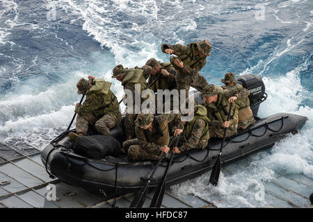 U.S. Marines assigned to Foxtrot Company, Battalion Landing Team, 2nd Battalion, 5th Marine Regiment, 31st Marine Expeditionary Unit conduct launch and recovery operations with a combat rubber raiding craft from the well deck of the amphibious transport dock ship USS Denver (LPD 9) March 1, 2014, in the East China Sea. The Denver, part of the Bonhomme Richard Amphibious Ready Group, was conducting operations in the U.S. 7th Fleet area of operations. (DoD photo by Mass Communication Specialist 3rd Class Todd C. Behrman, U.S. Navy/Released) U.S. Marines assigned to Foxtrot Company, Battalion Lan