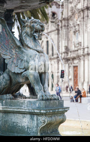Porto, Portugal: Lions Fountain on Gomes Teixeira Square and Igreja do Carmo in background. Stock Photo