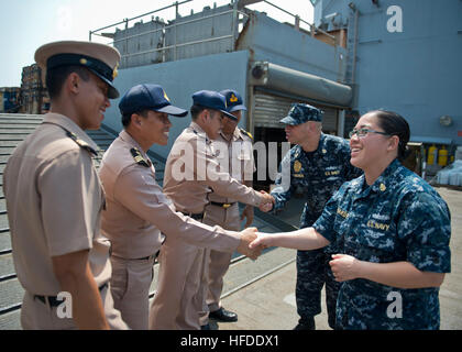 GULF OF THAILAND (Feb. 19, 2013) Chief Culinary Specialist Siriphone Phakdy, right, and Chief Master at Arms John Lokosus shake hands with members of the Royal Thai Navy during a tour aboard the Whidbey Island-class amphibious dock landing ship USS Tortuga (LSD 46). Tortuga is part of the Bonhomme Richard Amphibious Ready Group and is operating in the U.S. 7th Fleet area of operations. (U.S. Navy photo by Mass Communication Specialist 3rd Class Gregory A. Harden II/Released) 130219-N-HI414-205  Join the conversation http://www.facebook.com/USNavy http://www.twitter.com/USNavy http://navylive.d Stock Photo
