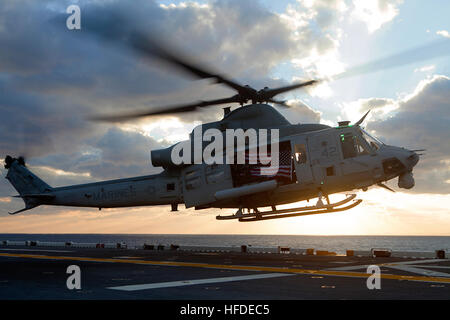 150107-M-QZ288-250  MEDITERRANEAN SEA (Jan. 7, 2015) An UH-1Y Huey, assigned to Marine Medium Tiltrotor Squadron 365 (Reinforced), 24th Marine Expeditionary Unit (MEU), takes off from the amphibious transport dock ship USS Iwo Jima (LPD 7) during a live-fire exercise. The 24th MEU and Iwo Jima Amphibious Ready Group are conducting naval operations in the U.S. 6th Fleet area of responsibility in support of U.S. national security interests in Europe. (U.S. Marine Corps photo by Lance Cpl. Austin A. Lewis/Released) UH-1Y of VMM-365 (R) takes off from USS Iwo Jima (LHD-7) in January 2015 Stock Photo