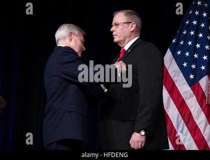 WASHINGTON (March 21, 2013) Secretary of the Navy (SECNAV) the Honorable Ray Mabus presents Under Secretary of the Navy (UNSECNAV) Robert Work with the Distinguished Public Service Medal, the Department of the Navy's highest award for civilians, during a farewell ceremony in the Pentagon auditorium. Mabus presented the award for Work's exemplary service and execution of strategic guidance for the Navy and Marine Corps while serving as the Under Secretary of the Navy. (U.S. Navy photo by Chief Mass Communication Specialist Sam Shavers/Released) 130321-N-AC887-005  Join the conversation http://w Stock Photo