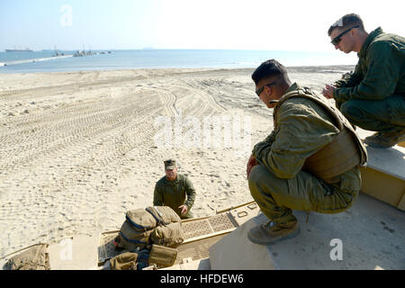 Staff Sgt. Anthony E. Garcia, tank commander and Section Leader, San Bernardino, Ca., left, Cpl. Allan Valdez, gunner, Oceanside, Ca., and Cpl. Daniel Pearson, loader, San Diego, assigned to Marine Corps Alpha Company 4th Tanks Battalion based in Camp Pendleton, Calif., participate in Combined Joint Logistics Over the Shore (CJLOTS) military exercise underway on the Korean Peninsula April 18-28. The naval exercise aims to improve logistics interoperability, communication and cooperation between the United States and South Korea. (U.S. Navy photo by Mass Communication Specialist First Class Eli Stock Photo